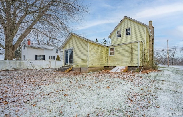 view of snow covered house