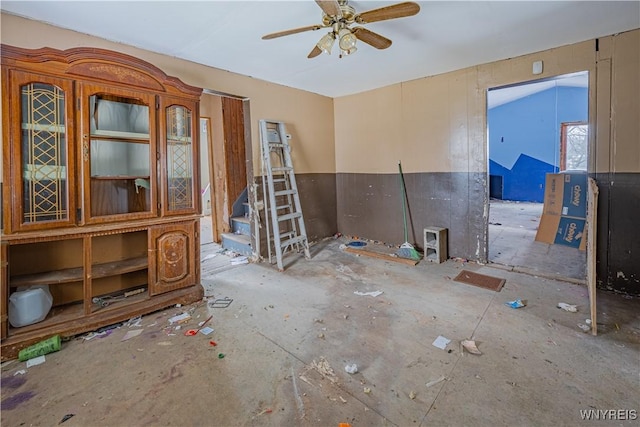 interior space featuring ceiling fan