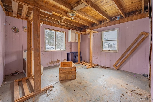 miscellaneous room featuring wooden walls