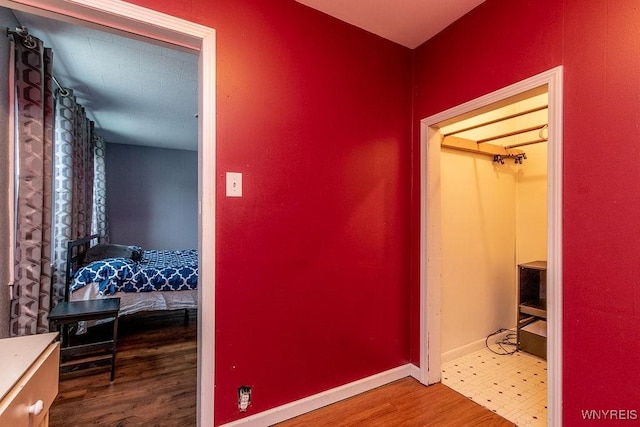 corridor featuring wood-type flooring