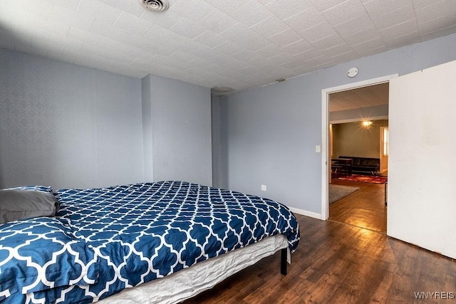 bedroom featuring hardwood / wood-style flooring