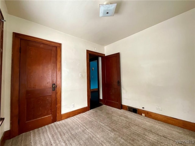 unfurnished bedroom with carpet floors