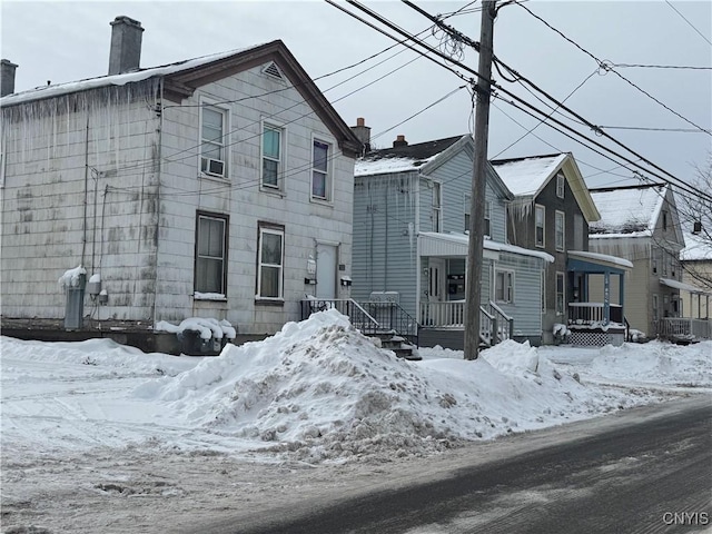 744 Jay St, Utica, NY 13501 - view of front facade with a chimney and cooling unit