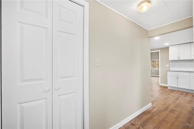 hall with light wood-type flooring