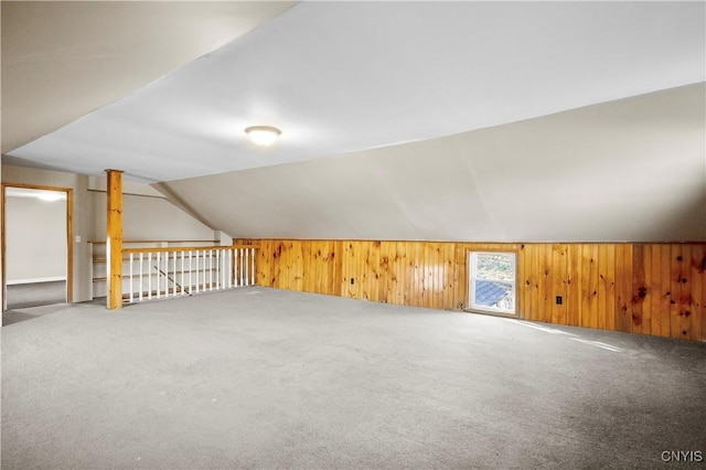 bonus room with carpet floors and lofted ceiling