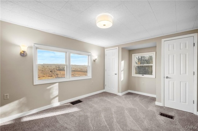 unfurnished bedroom with light carpet