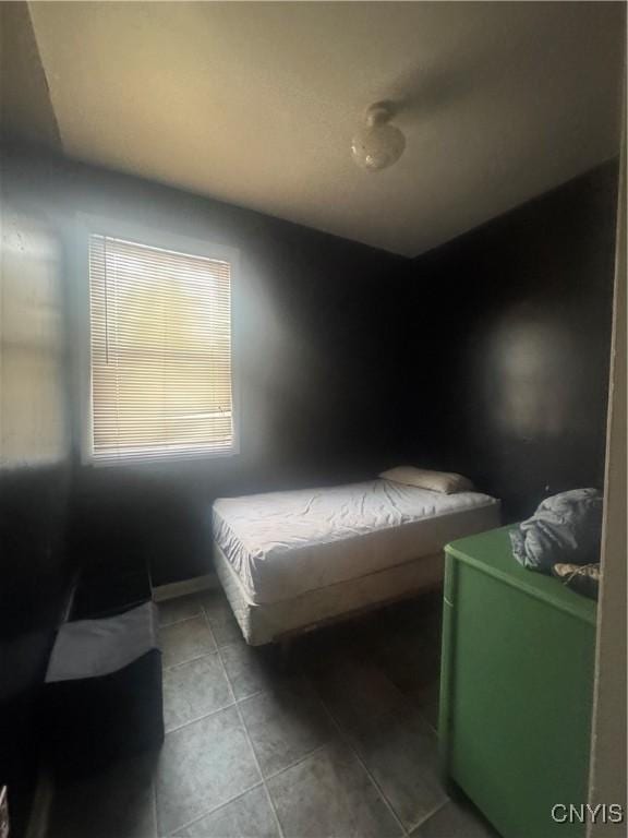 bedroom with tile patterned floors