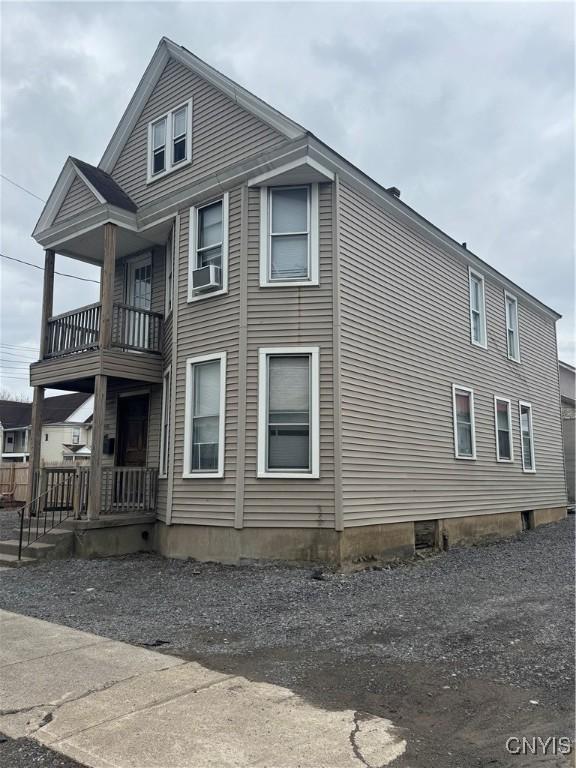 748 Jay St, Utica, NY 13501 - view of home's exterior featuring cooling unit and a balcony