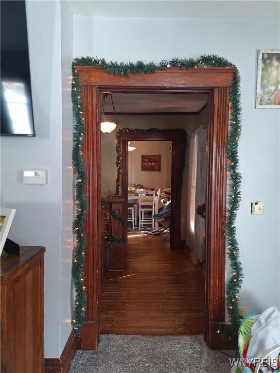 hallway featuring carpet flooring