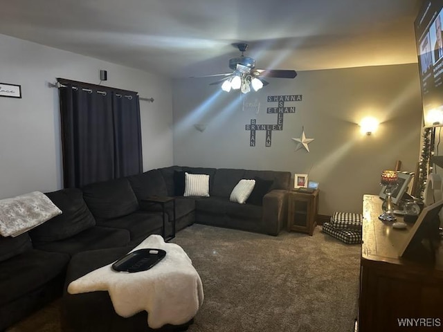 carpeted living room with ceiling fan