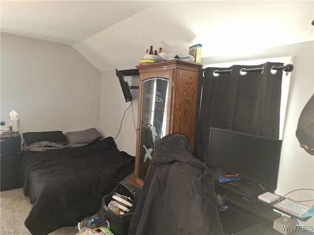 carpeted bedroom featuring vaulted ceiling