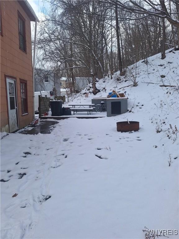 view of yard covered in snow