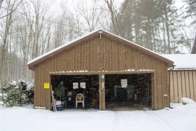 view of snow covered garage