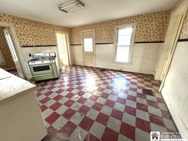 kitchen featuring white range with gas cooktop