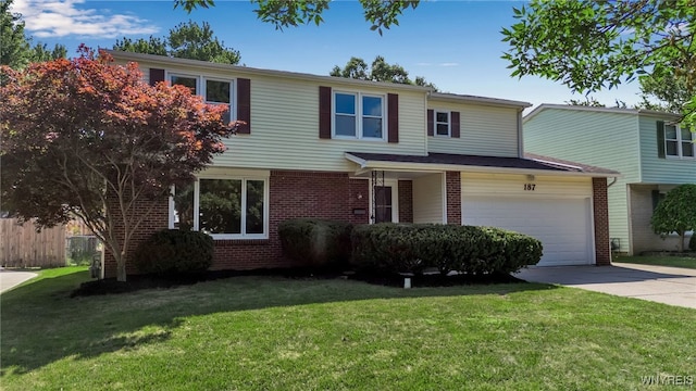 view of front property featuring a front yard and a garage