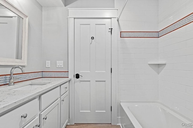 bathroom with vanity and  shower combination