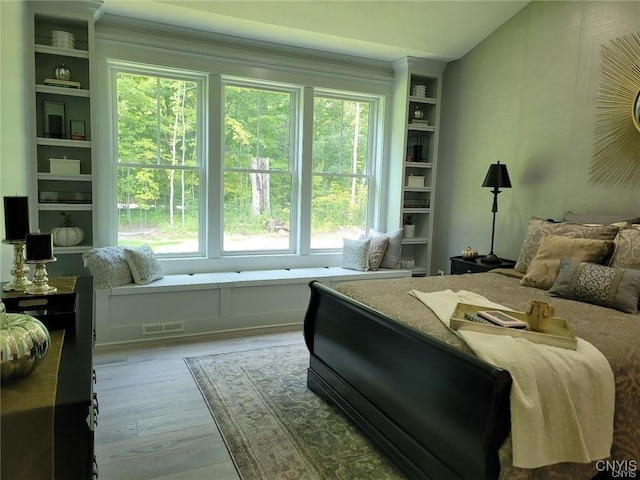 bedroom with light hardwood / wood-style flooring