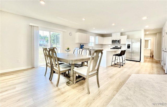 dining space featuring light hardwood / wood-style floors