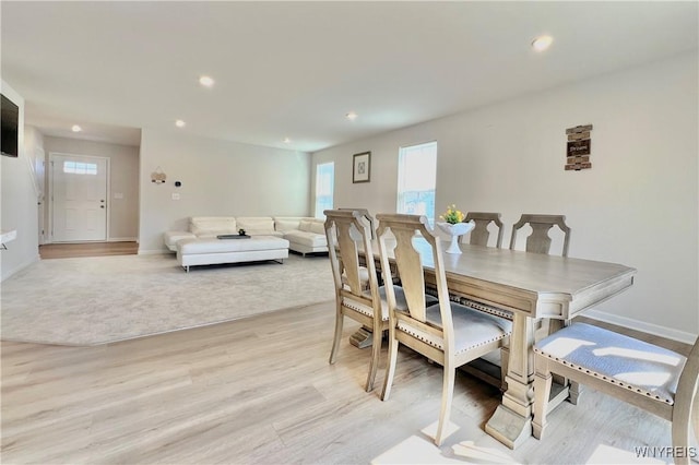 dining space with light hardwood / wood-style flooring