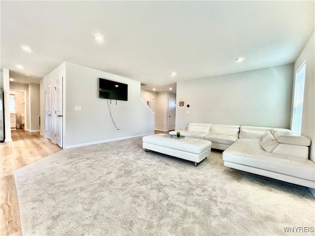 living room featuring light carpet