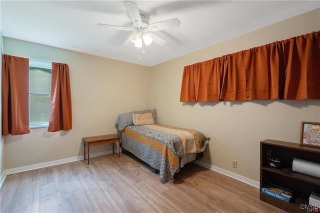 bedroom featuring ceiling fan and light hardwood / wood-style floors