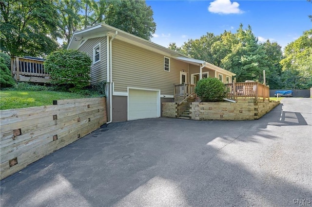 view of side of home with a garage