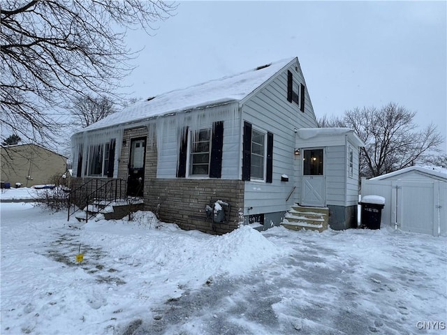 view of front of house with a shed