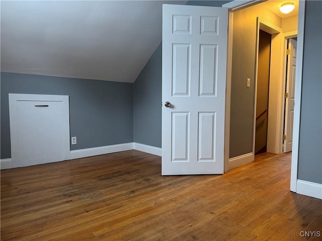 bonus room featuring hardwood / wood-style flooring and vaulted ceiling