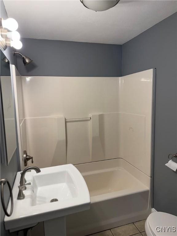 full bathroom with sink, shower / tub combination, tile patterned floors, and toilet