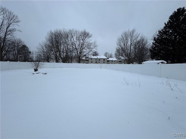 view of yard layered in snow