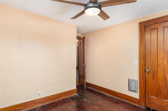 unfurnished room with ceiling fan and dark hardwood / wood-style floors