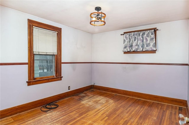 spare room with hardwood / wood-style floors