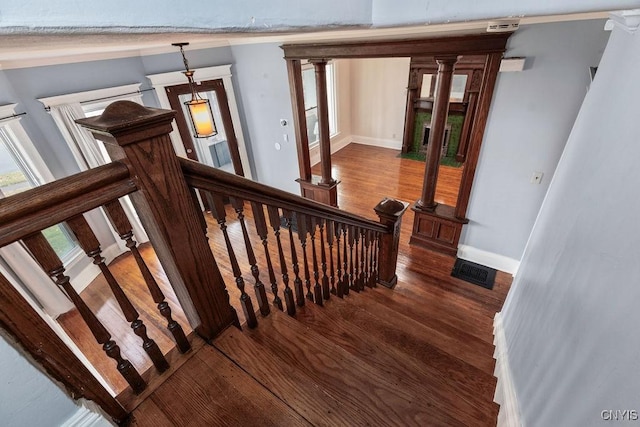 stairway with hardwood / wood-style floors