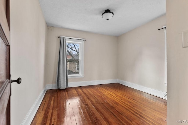 spare room featuring hardwood / wood-style flooring