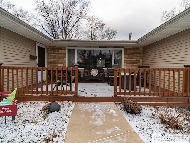 view of snow covered deck