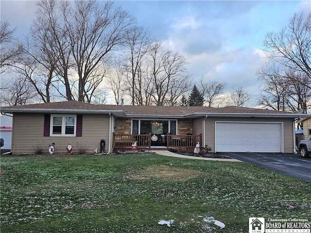 ranch-style home with a porch, a garage, and a front yard