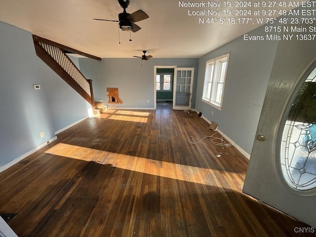 interior space featuring ceiling fan and dark hardwood / wood-style flooring