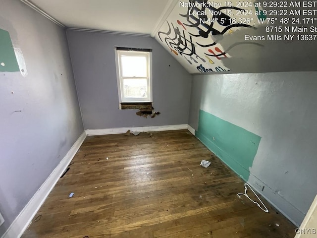 additional living space with dark hardwood / wood-style flooring and lofted ceiling