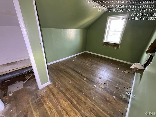 bonus room featuring dark hardwood / wood-style floors and vaulted ceiling