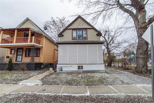 view of front of property with a balcony