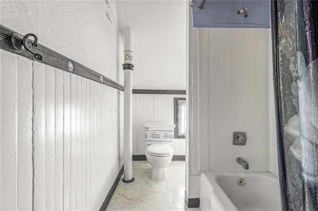 bathroom with shower / tub combo with curtain and toilet