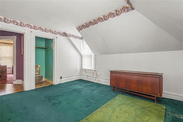 bonus room featuring carpet floors and vaulted ceiling