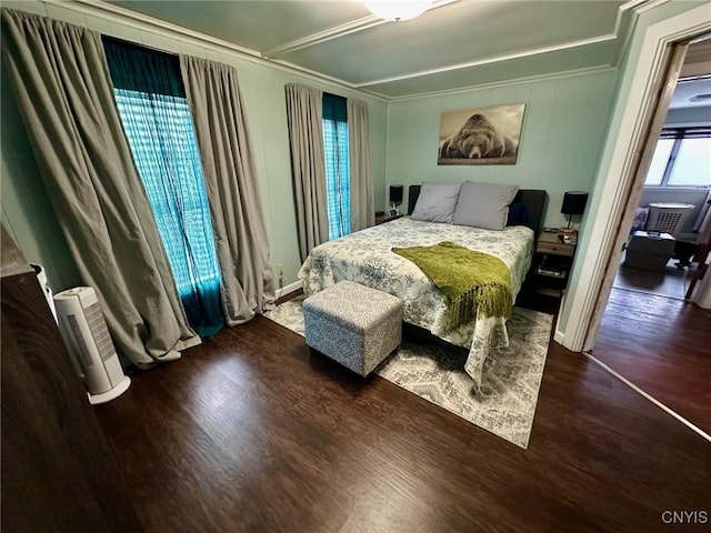 bedroom with dark hardwood / wood-style flooring