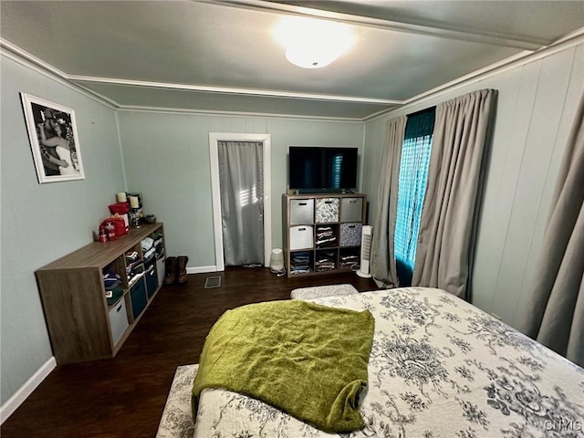 bedroom with dark wood-type flooring