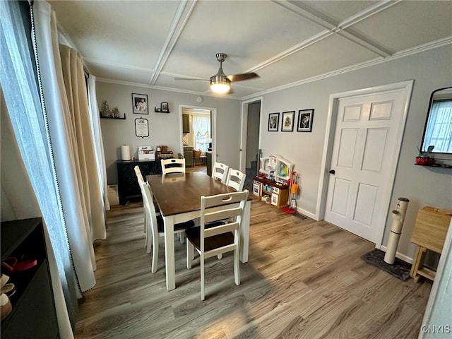 dining room with ceiling fan, coffered ceiling, and hardwood / wood-style flooring