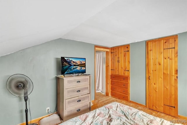 bedroom featuring vaulted ceiling