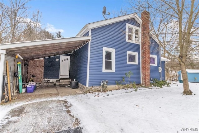 view of front of home featuring a carport