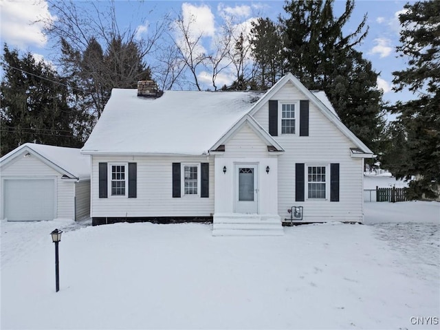 view of front of home featuring a garage and an outdoor structure