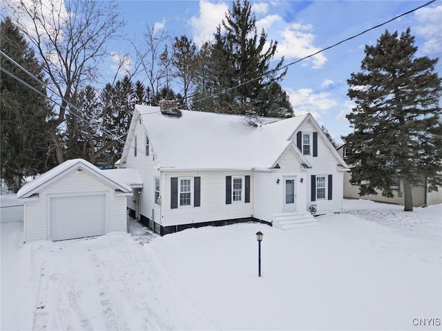 view of front of house featuring a garage and an outdoor structure