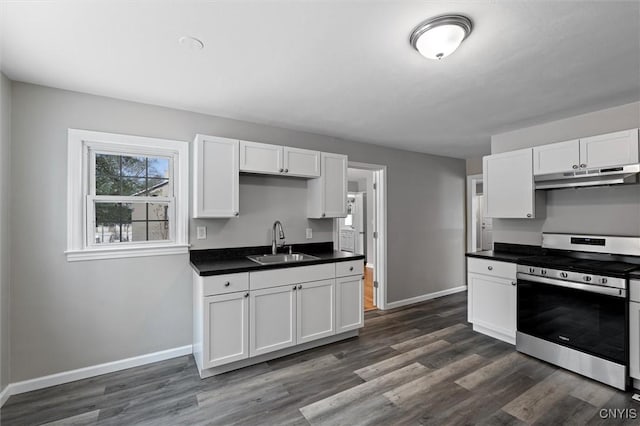 kitchen with sink, white cabinetry, dark wood-type flooring, and stainless steel range oven